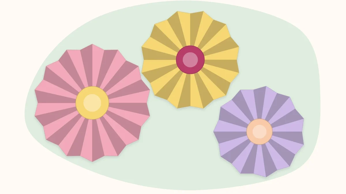 Three round accordion-fold paper flowers with contrasting centers