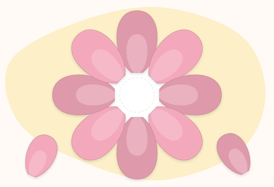 The first ring of large cupped cardstock petals glued around a round paper base, leaving the middle open