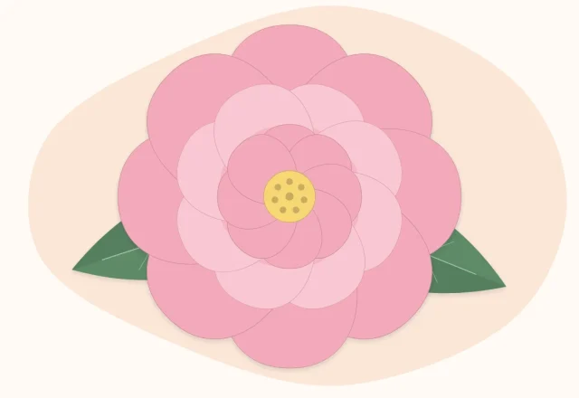 One giant layered paper flower with two large green leaves