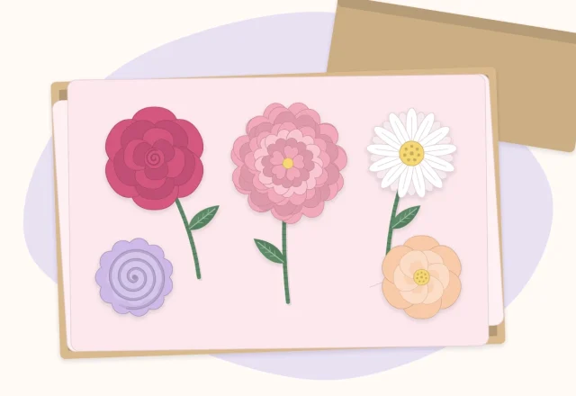 Paper flowers resting face up in an open box lined with white tissue paper