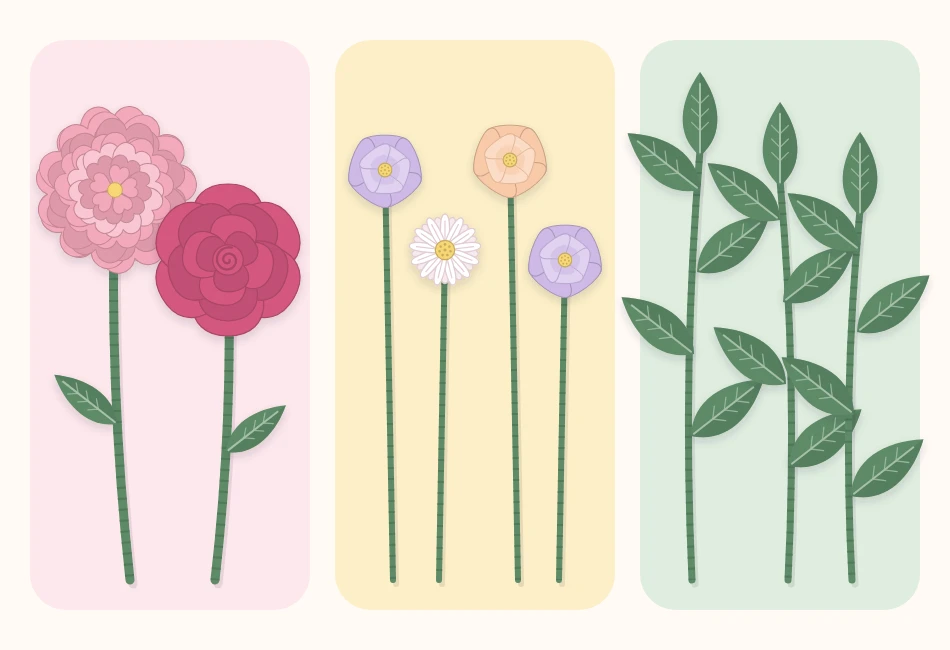 Stemmed paper flowers sorted into three groups on a table: large focal flowers, small filler flowers and leaves