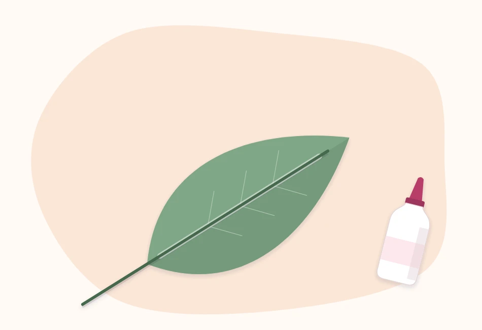 A green paper leaf with a thin wire glued along its center vein, the wire extending below the base