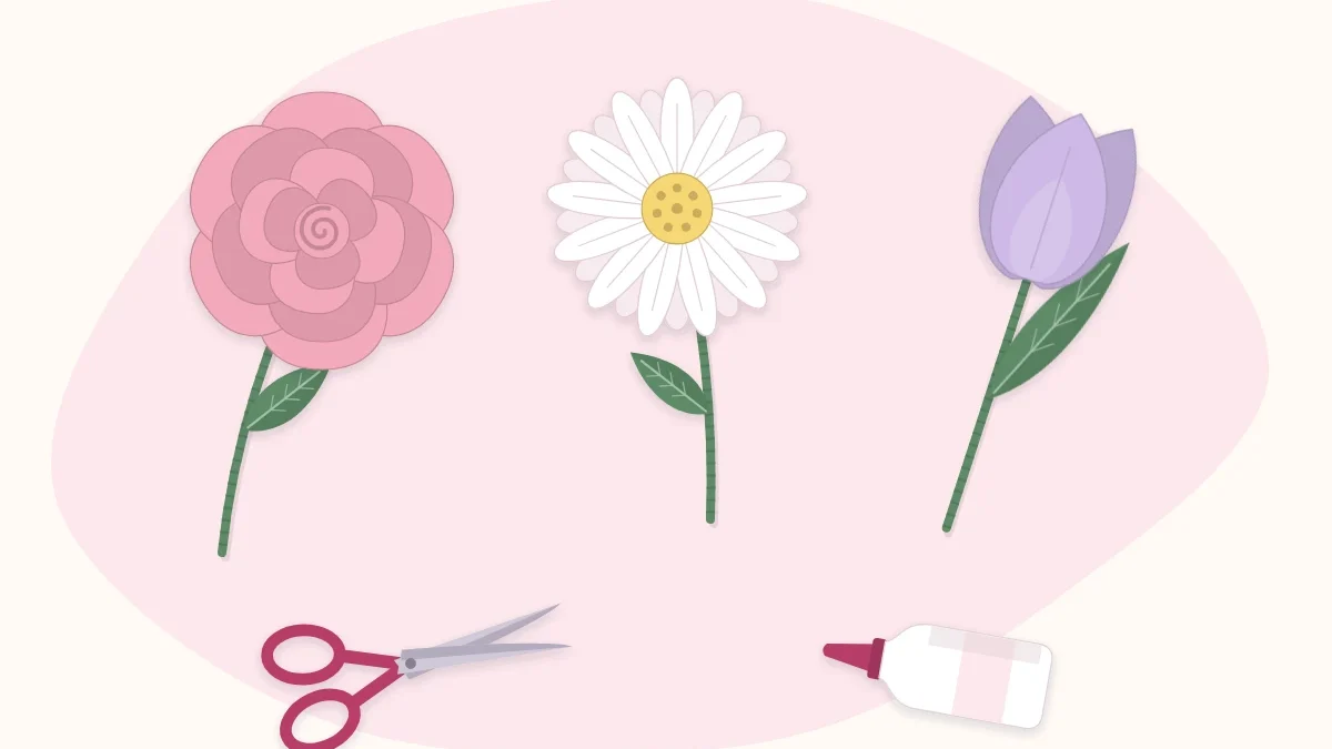 A simple paper rose, daisy and tulip lying beside scissors and a glue bottle