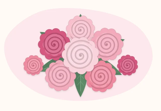 Cluster of small rolled spiral paper roses in shades of pink